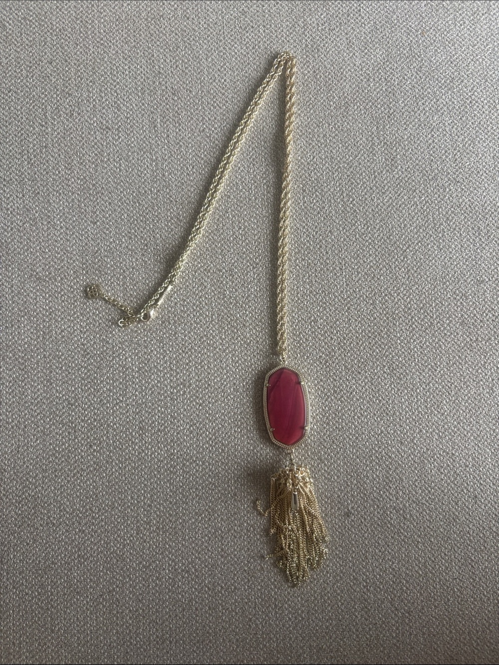 Kendra Scott Gold Tassel Pendant Necklace with maroon Stone